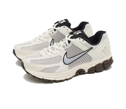 Nike Vomero 5 Sneakers in Metallic Silver and White