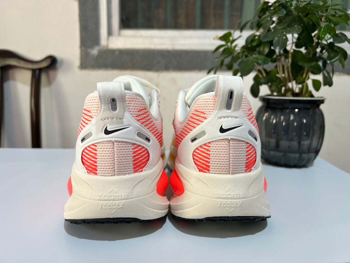 Nike Vomero 18 Running Shoes, White and Coral