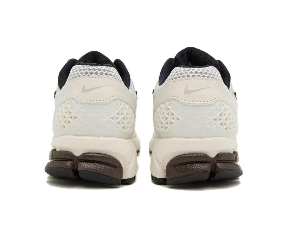 Nike Vomero 5 Sneakers in Metallic Silver and White