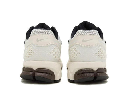 Nike Vomero 5 Sneakers in Metallic Silver and White